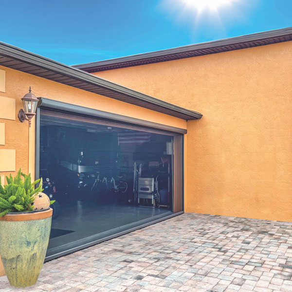 motorized shade for residential garage installed by Ventana Outdoor Shades & Awnings in Houston, TX