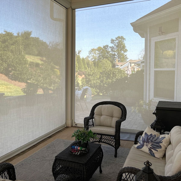 covered patio with motorized shades installed by Ventana Outdoor Shades & Awnings in Houston, TX