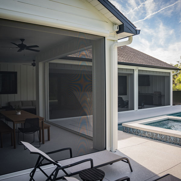 another view of patio with motorized shades installed by Ventana Outdoor Shades & Awnings in Houston, TX